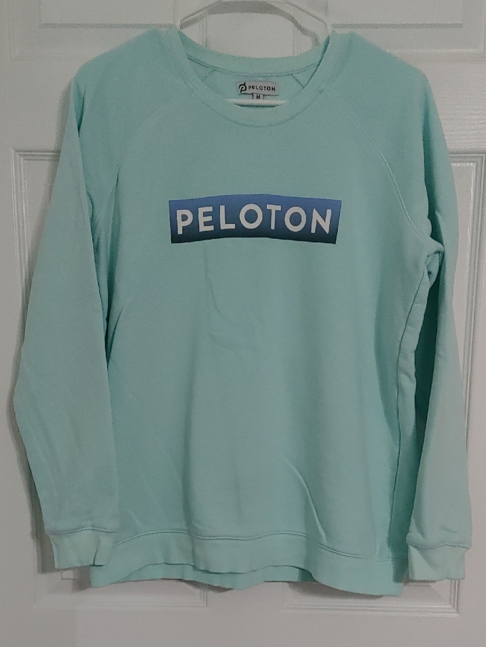 Peloton Mint Crewneck Sweatshirt Size Medium, has streak towards bottom